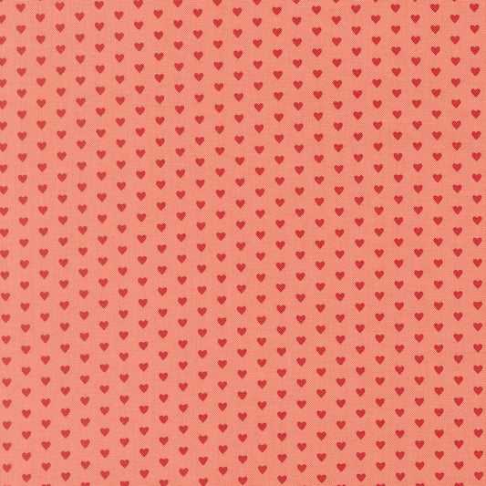Moda's small red hearts on tea rose pink Toast and Jam by Elizabeth Hartman cotton quilting fabric for Valentine's Day or nursery.