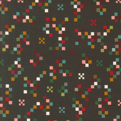 Twinkle and Tinsel by Fancy That Design House cotton quilting fabric features colorful pixelated squares on charcoal.