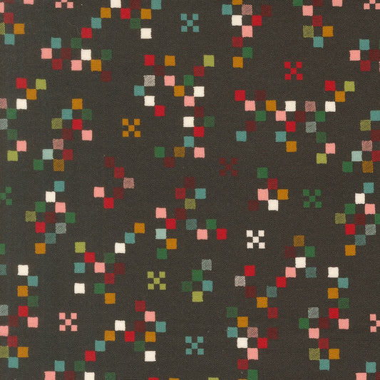 Twinkle and Tinsel by Fancy That Design House cotton quilting fabric features colorful pixelated squares on charcoal.
