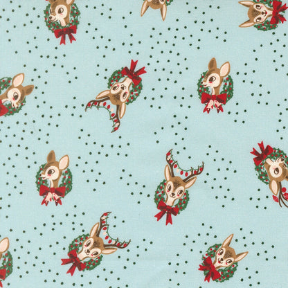 Moda's Twinkle and Tinsel by Fancy That Design House cotton quilting fabric. Christmas deer heads with antlers in green wreaths, red bows & berries on mist blue.