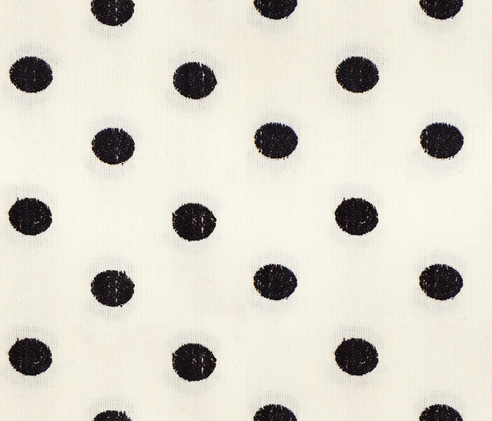 Moda's black polka dots on cream cotton quilting fabric from Warp Weft Daisy Days by Ruby Star Society's Alexia Abegg.