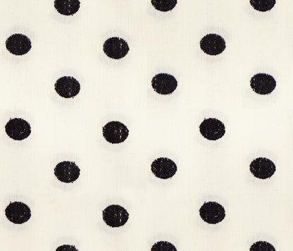 Moda's black polka dots on cream cotton quilting fabric from Warp Weft Daisy Days by Ruby Star Society's Alexia Abegg.