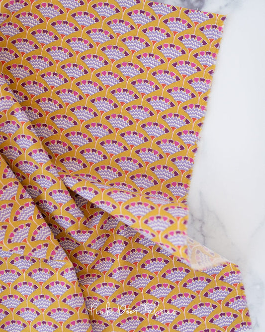 Cotton quilting fabric pattern called 'Tasselflower in Mustard'. Part of the 'Pie in the Sky' fabric collection. Designed by Tilda Fabrics for fabric company Tilda Fabrics. SKU: 100481. 44-45 inch width.