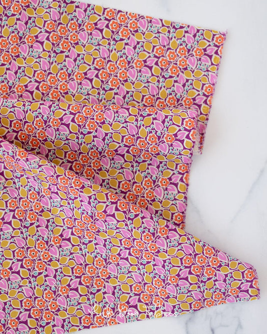 Cotton quilting fabric pattern called 'Topsy Turvy in Plum'. Part of the 'Pie in the Sky' fabric collection. Designed by Tilda Fabrics for fabric company Tilda Fabrics. SKU: 100483. 44-45 inch width.