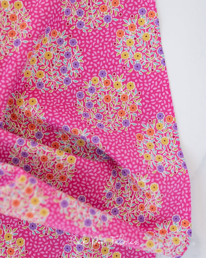 Cotton quilting fabric pattern called 'Confetti in Cerise'. Part of the 'Pie in the Sky' fabric collection. Designed by Tilda Fabrics for fabric company Tilda Fabrics. SKU: 100484. 44-45 inch width.