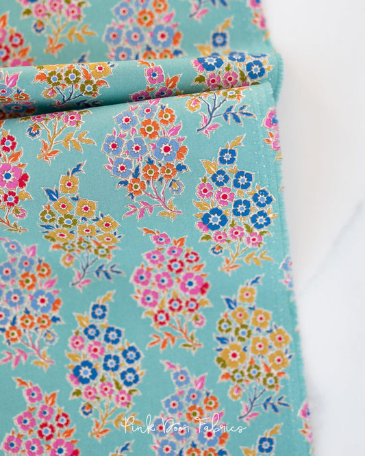 Cotton quilting fabric pattern called 'Willy Nilly in Teal'. Part of the 'Pie in the Sky' fabric collection. Designed by Tilda Fabrics for fabric company Tilda Fabrics. SKU: 100487. 44-45 inch width.