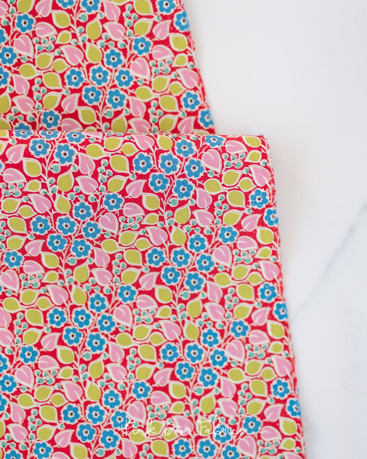 Cotton quilting fabric pattern called 'Topsy Turvy in Red'. Part of the 'Pie in the Sky' fabric collection. Designed by Tilda Fabrics for fabric company Tilda Fabrics. SKU: 100492. 44-45 inch width.