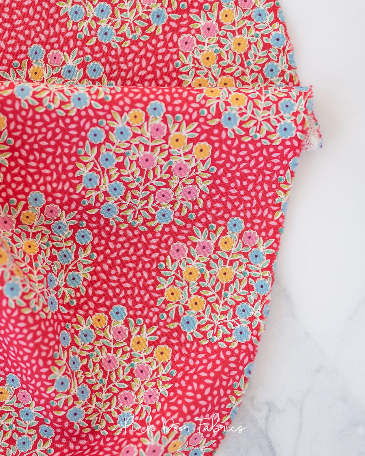 Cotton quilting fabric pattern called 'Confetti in Red'. Part of the 'Pie in the Sky' fabric collection. Designed by Tilda Fabrics for fabric company Tilda Fabrics. SKU: 100493. 44-45 inch width.