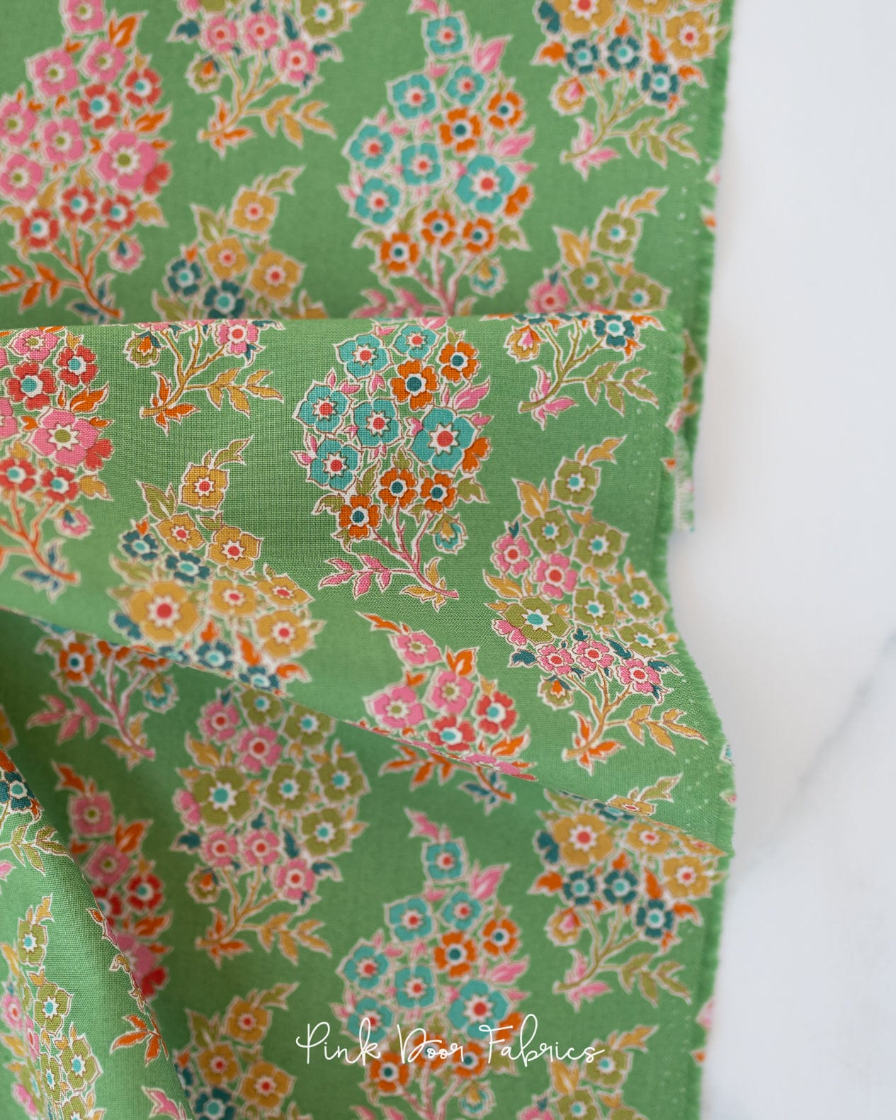 Cotton quilting fabric pattern called 'Willy Nilly in Green'. Part of the 'Pie in the Sky' fabric collection. Designed by Tilda Fabrics for fabric company Tilda Fabrics. SKU: 100496. 44-45 inch width.