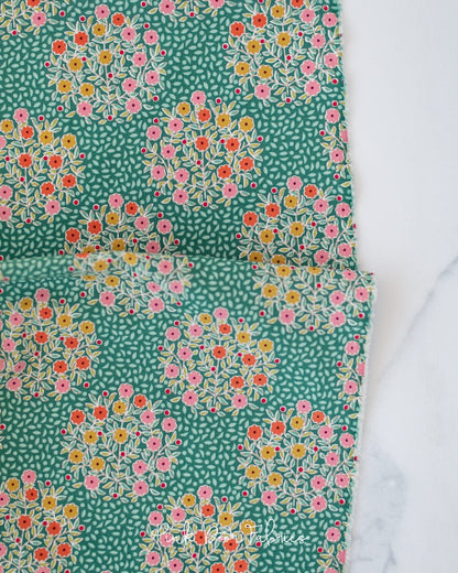 Cotton quilting fabric pattern called 'Confetti in Pine'. Part of the 'Pie in the Sky' fabric collection. Designed by Tilda Fabrics for fabric company Tilda Fabrics. SKU: 100500. 44-45 inch width.