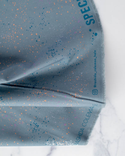 Cotton quilting fabric pattern called 'Blue Slate'. Part of the 'Speckled Metallic' fabric collection. Designed by Ruby Star Society for fabric company Moda Fabrics. SKU: RS5027 108M. 44-45 inch width.