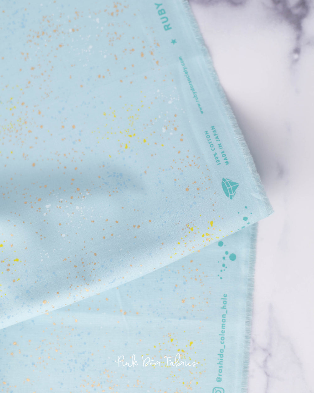 Cotton quilting fabric pattern called 'Polar'. Part of the 'Speckled Metallic' fabric collection. Designed by Ruby Star Society for fabric company Moda Fabrics. SKU: RS5027 101M. 44-45 inch width.