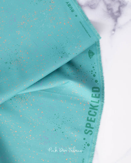 Cotton quilting fabric pattern called 'Succulent'. Part of the 'Speckled Metallic' fabric collection. Designed by Ruby Star Society for fabric company Moda Fabrics. SKU: RS5027 107M. 44-45 inch width.