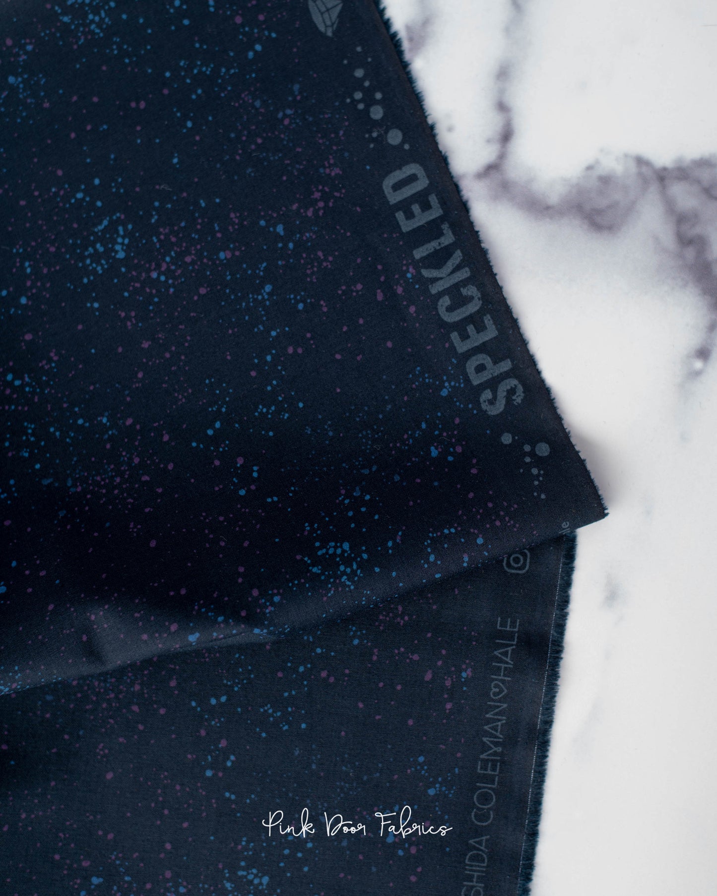 Cotton quilting fabric pattern called 'Galaxy'. Part of the 'Speckled Metallic' fabric collection. Designed by Ruby Star Society for fabric company Moda Fabrics. SKU: RS5027 103. 44-45 inch width.