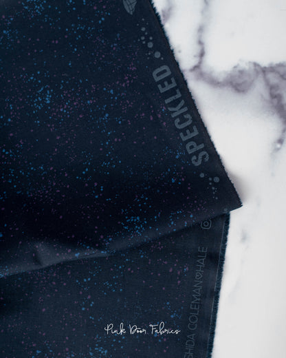 Cotton quilting fabric pattern called 'Galaxy'. Part of the 'Speckled Metallic' fabric collection. Designed by Ruby Star Society for fabric company Moda Fabrics. SKU: RS5027 103. 44-45 inch width.