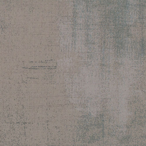 Cotton quilting fabric pattern called 'Grunge in Grey Couture'. Part of the 'Grunge Basics' fabric collection. Designed by Basic Grey for fabric company Moda Fabrics. SKU: 30150 163. 44-45 inch width.