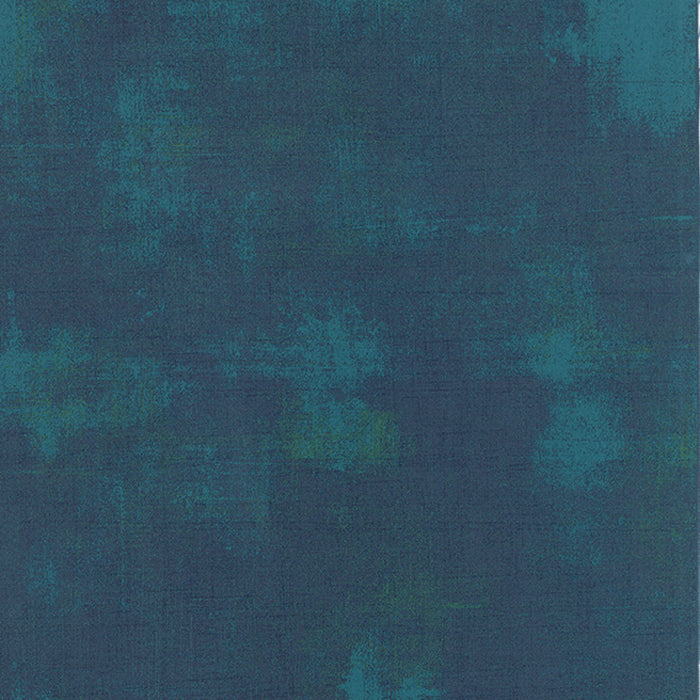 Cotton quilting fabric pattern called 'Grunge in Peacock'. Part of the 'Grunge Basics' fabric collection. Designed by Basic Grey for fabric company Moda Fabrics. SKU: 30150 230. 44-45 inch width.