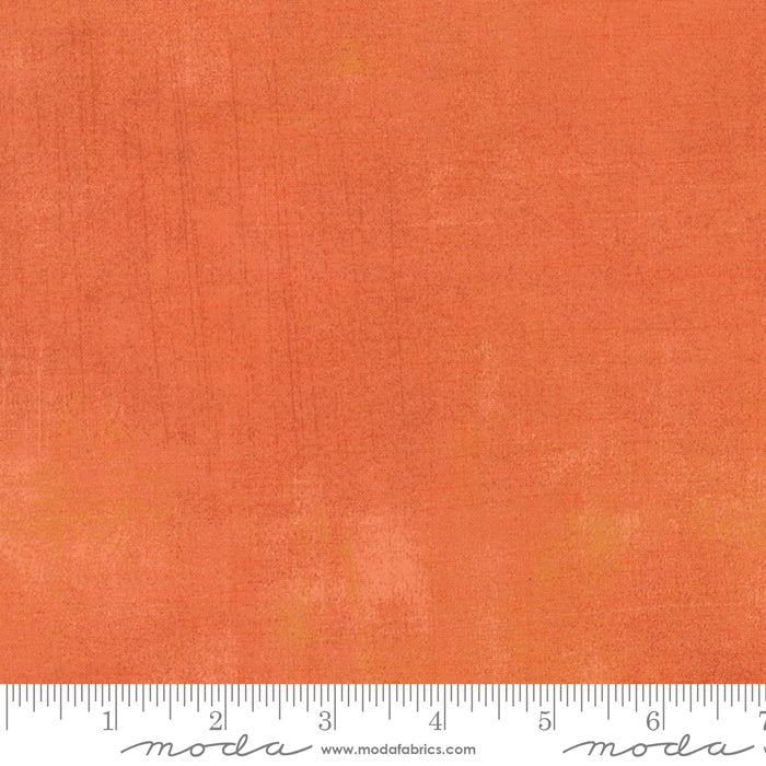 Cotton quilting fabric pattern called 'Grunge in Papaya'. Part of the 'Grunge Basics' fabric collection. Designed by Basic Grey for fabric company Moda Fabrics. SKU: 30150 261. 44-45 inch width.
