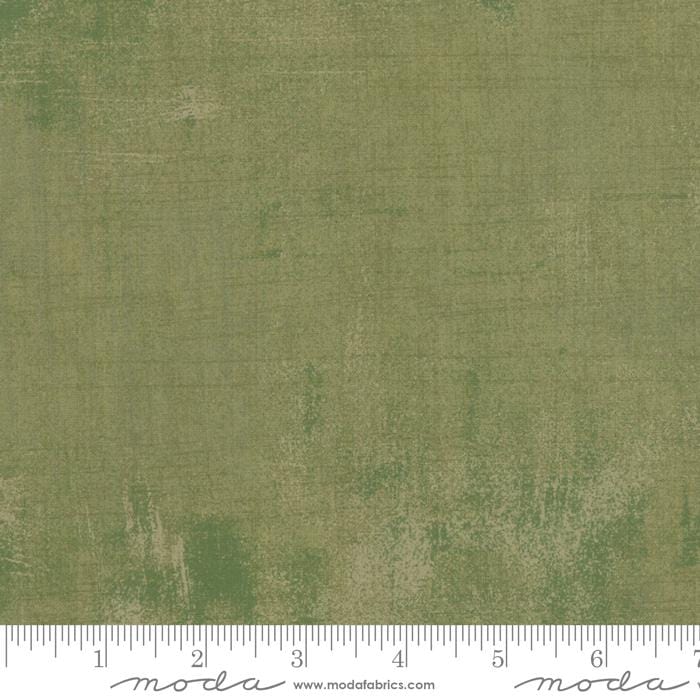 Cotton quilting fabric pattern called 'Grunge in Vert'. Part of the 'Christmas Eve' fabric collection. Designed by Lella Boutique for fabric company Moda Fabrics. SKU: 31050 274. 44-45 inch width.