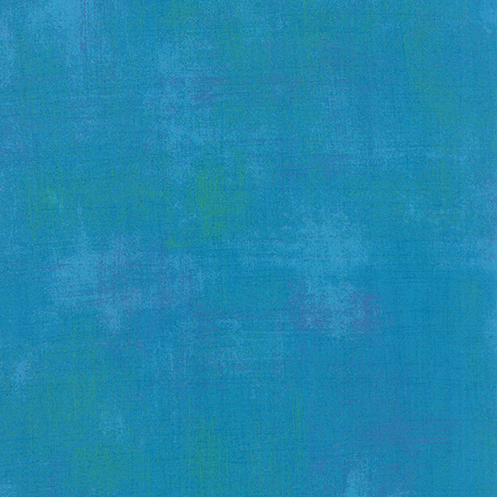Cotton quilting fabric pattern called 'Grunge in Turquoise'. Part of the 'Grunge Basics' fabric collection. Designed by Basic Grey for fabric company Moda Fabrics. SKU: 30150 298. 44-45 inch width.