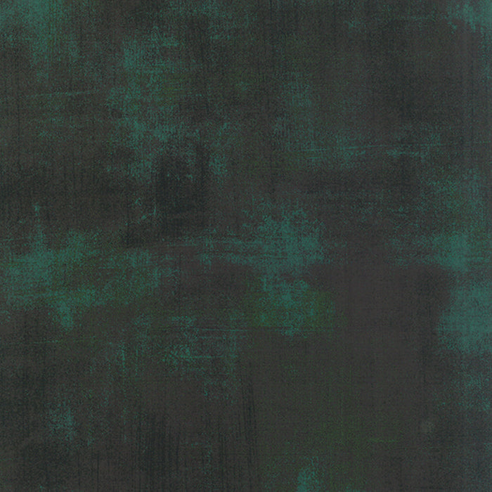 Cotton quilting fabric pattern called 'Grunge in Christmas Green'. Part of the 'Grunge Basics' fabric collection. Designed by Basic Grey for fabric company Moda Fabrics. SKU: 30150-308. 44-45 inch width.