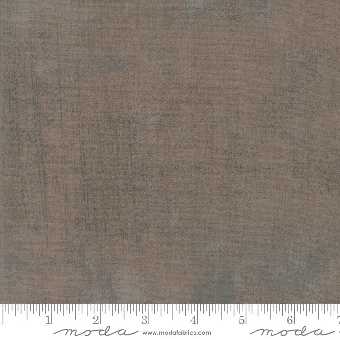 Cotton quilting fabric pattern called 'Grunge in Light Maven Taupe'. Part of the 'Grunge Basics' fabric collection. Designed by Basic Grey for fabric company Moda Fabrics. SKU: 30150 373. 44-45 inch width.