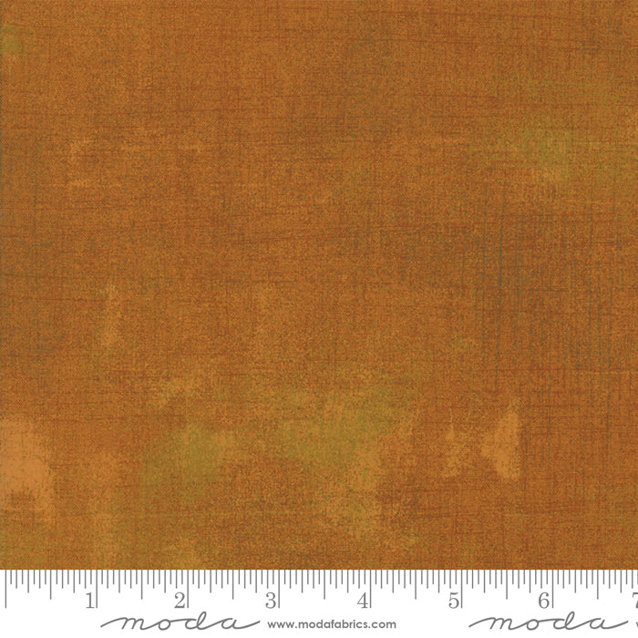 Cotton quilting fabric pattern called 'Grunge in Yam'. Part of the 'Grunge Basics' fabric collection. Designed by Basic Grey for fabric company Moda Fabrics. SKU: 30150 422. 44-45 inch width.