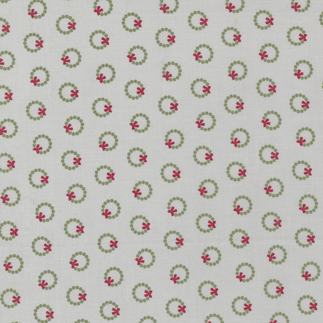 Cotton quilting fabric pattern called 'Wreath Dot in Silver'. Part of the 'Christmas Eve' fabric collection. Designed by Lella Boutique for fabric company Moda Fabrics. SKU: 1199427. 44-45 inch width.