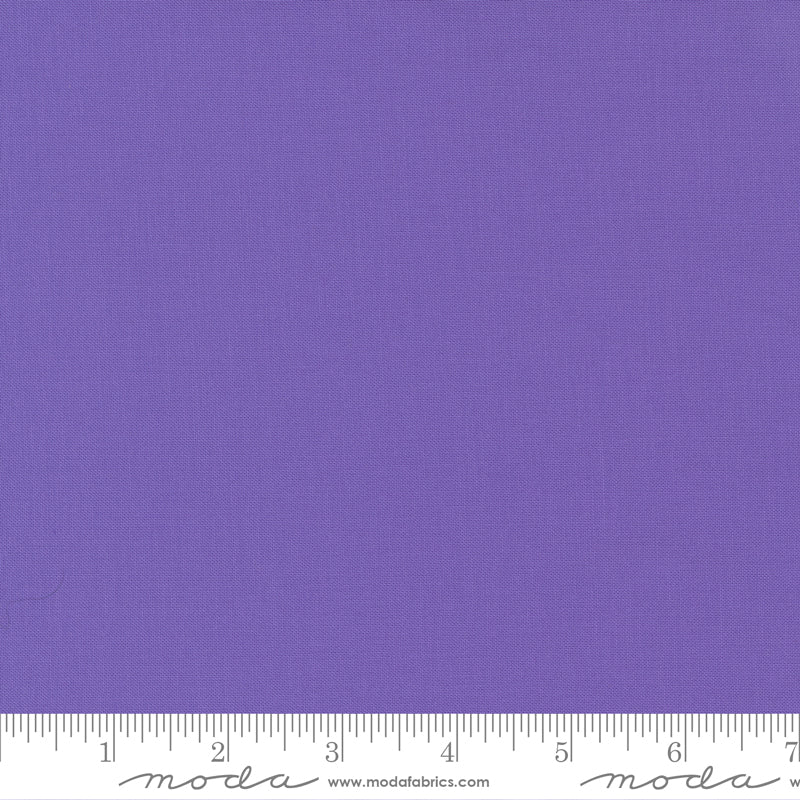 Cotton quilting fabric pattern called 'Amelia Purple'. Part of the 'Bella Solids' fabric collection. Designed by Moda Fabrics for fabric company Moda Fabrics. SKU: 9900 165. 44-45 inch width.