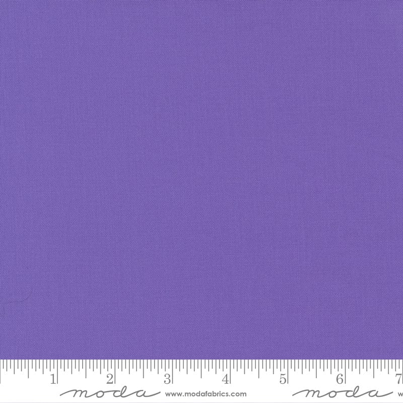Cotton quilting fabric pattern called 'Amelia Purple'. Part of the 'Bella Solids' fabric collection. Designed by Moda Fabrics for fabric company Moda Fabrics. SKU: 9900 165. 44-45 inch width.