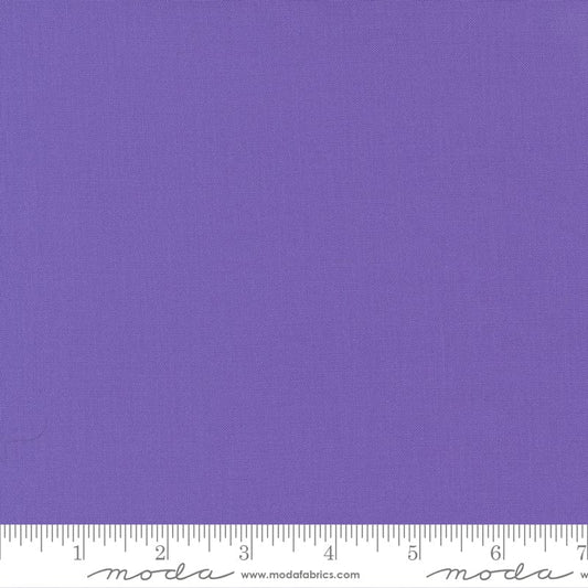 Cotton quilting fabric pattern called 'Amelia Purple'. Part of the 'Bella Solids' fabric collection. Designed by Moda Fabrics for fabric company Moda Fabrics. SKU: 9900 165. 44-45 inch width.