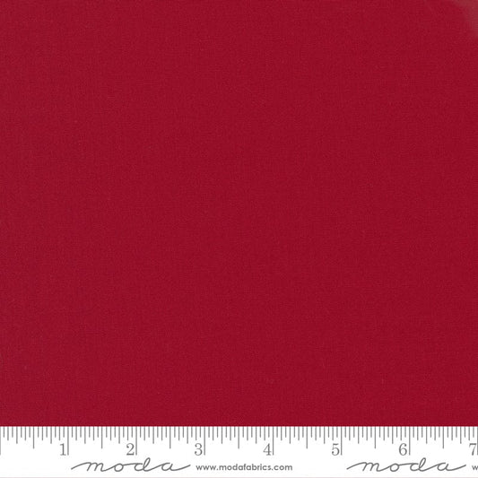 Cotton quilting fabric pattern called 'Country Red'. Part of the 'Bella Solids' fabric collection. Designed by Moda Fabrics for fabric company Moda Fabrics. SKU: 9900 17. 44-45 inch width.