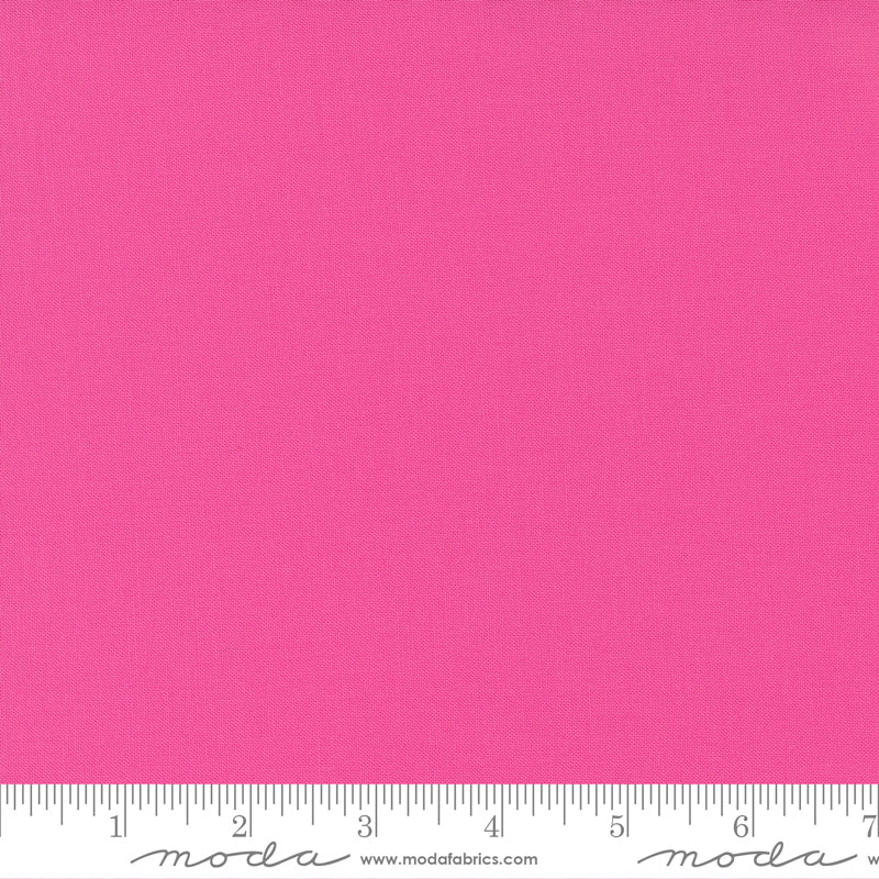 Cotton quilting fabric pattern called 'Fuchsia'. Part of the 'Bella Solids' fabric collection. Designed by Moda Fabrics for fabric company Moda Fabrics. SKU: 9900 190. 44-45 inch width.