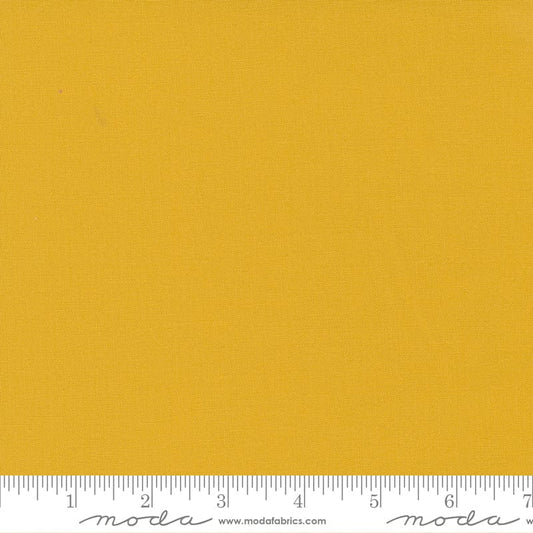 Cotton quilting fabric pattern called 'Mustard'. Part of the 'Bella Solids' fabric collection. Designed by Moda Fabrics for fabric company Moda Fabrics. SKU: 9900 213. 44-45 inch width.