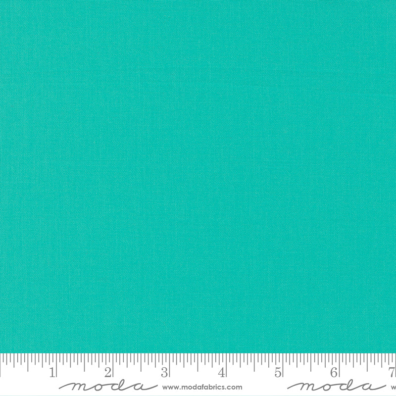 Cotton quilting fabric pattern called 'Peacock'. Part of the 'Bella Solids' fabric collection. Designed by Moda Fabrics for fabric company Moda Fabrics. SKU: 9900 216. 44-45 inch width.