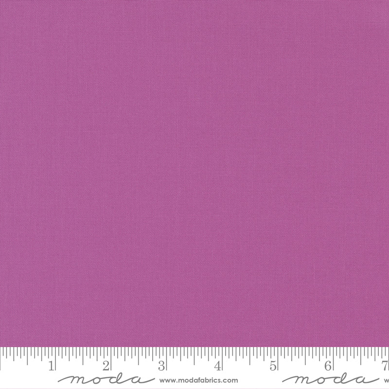 Cotton quilting fabric pattern called 'Violet'. Part of the 'Bella Solids' fabric collection. Designed by Moda Fabrics for fabric company Moda Fabrics. SKU: 9900 224. 44-45 inch width.