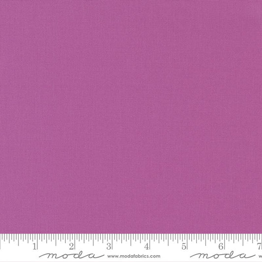 Cotton quilting fabric pattern called 'Violet'. Part of the 'Bella Solids' fabric collection. Designed by Moda Fabrics for fabric company Moda Fabrics. SKU: 9900 224. 44-45 inch width.