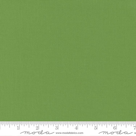 Cotton quilting fabric pattern called 'Fresh Grass'. Part of the 'Bella Solids' fabric collection. Designed by Moda Fabrics for fabric company Moda Fabrics. SKU: 9900 228. 44-45 inch width.