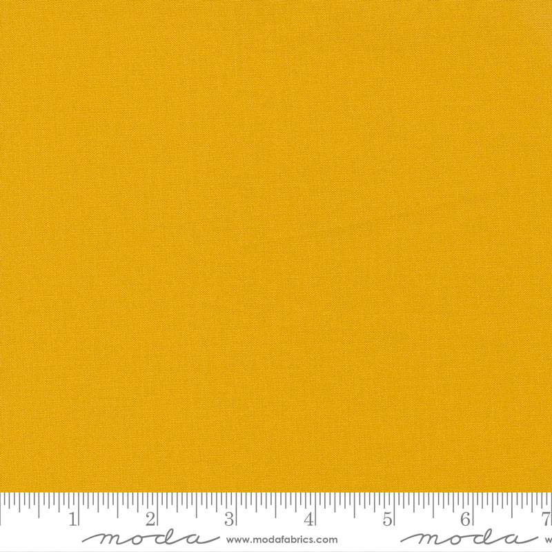 Cotton quilting fabric pattern called 'Saffron'. Part of the 'Bella Solids' fabric collection. Designed by Moda Fabrics for fabric company Moda Fabrics. SKU: 9900 232. 44-45 inch width.