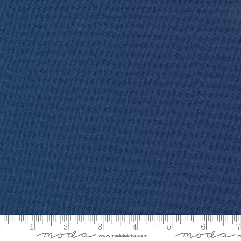 Cotton quilting fabric pattern called 'Nautical Blue'. Part of the 'Bella Solids' fabric collection. Designed by Moda Fabrics for fabric company Moda Fabrics. SKU: 9900 236. 44-45 inch width.