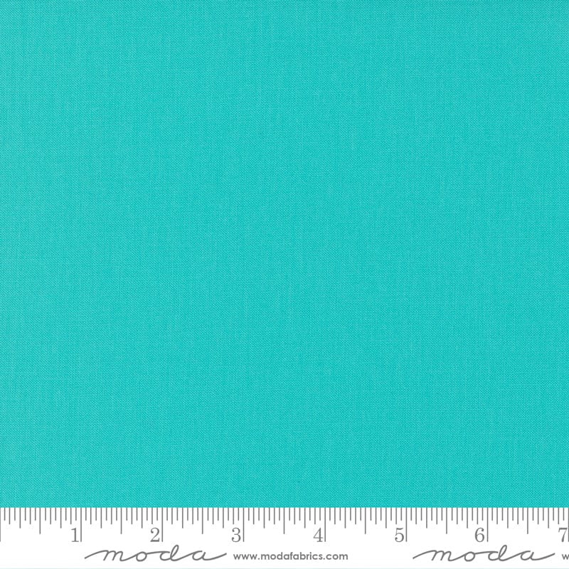 Cotton quilting fabric pattern called 'Bermuda'. Part of the 'Bella Solids' fabric collection. Designed by Moda Fabrics for fabric company Moda Fabrics. SKU: 9900 269. 44-45 inch width.