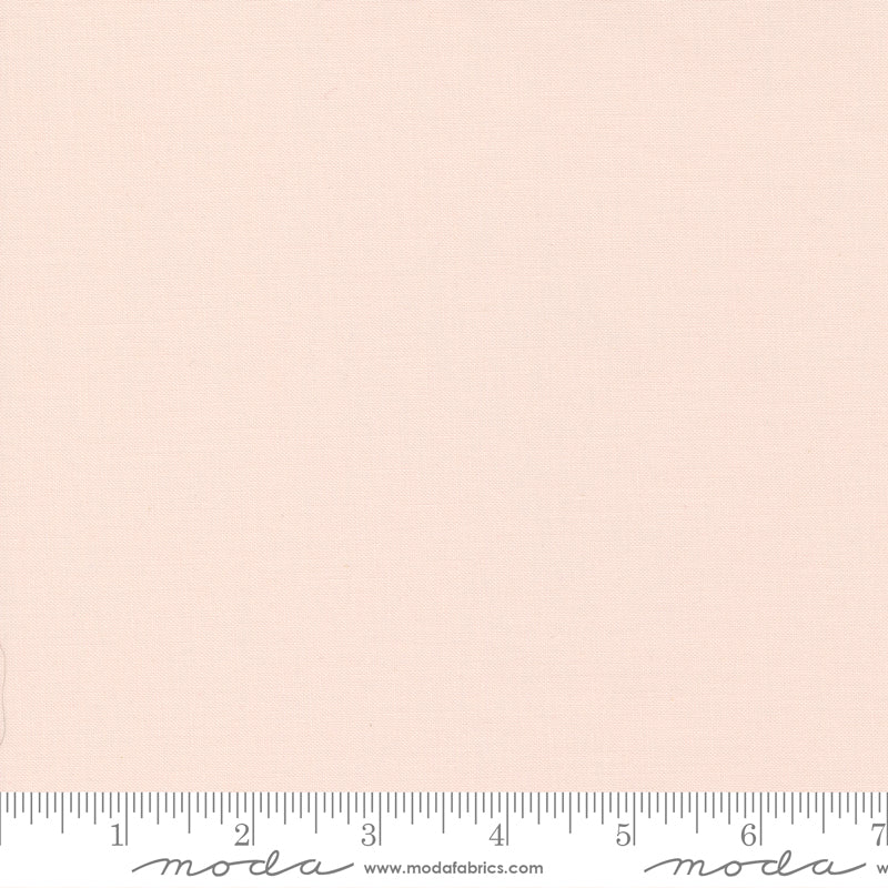 Cotton quilting fabric pattern called 'Pale Pink'. Part of the 'Bella Solids' fabric collection. Designed by Moda Fabrics for fabric company Moda Fabrics. SKU: 9900 26. 44-45 inch width.