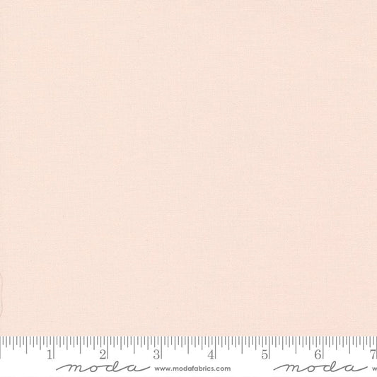 Cotton quilting fabric pattern called 'Pale Pink'. Part of the 'Bella Solids' fabric collection. Designed by Moda Fabrics for fabric company Moda Fabrics. SKU: 9900 26. 44-45 inch width.