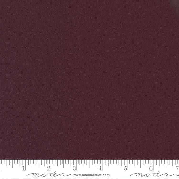 Cotton quilting fabric pattern called 'Merlot'. Part of the 'Bella Solids' fabric collection. Designed by Moda Fabrics for fabric company Moda Fabrics. SKU: 9900 279. 44-45 inch width.