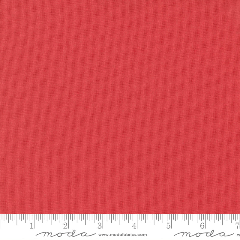 Cotton quilting fabric pattern called 'Persimmon'. Part of the 'Bella Solids' fabric collection. Designed by Moda Fabrics for fabric company Moda Fabrics. SKU: 9900 294. 44-45 inch width.