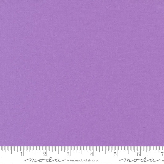 Cotton quilting fabric pattern called 'Sugar Plum'. Part of the 'Bella Solids' fabric collection. Designed by Moda Fabrics for fabric company Moda Fabrics. SKU: 9900 303. 44-45 inch width.
