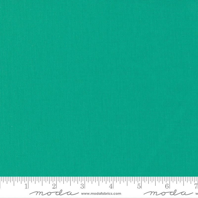 Cotton quilting fabric pattern called 'Spearmint'. Part of the 'Bella Solids' fabric collection. Designed by Moda Fabrics for fabric company Moda Fabrics. SKU: 9900 304. 44-45 inch width.