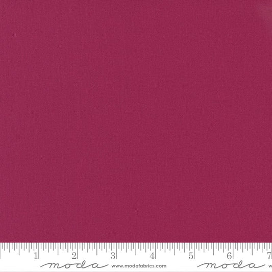 Cotton quilting fabric pattern called 'Garnet'. Part of the 'Bella Solids' fabric collection. Designed by Moda Fabrics for fabric company Moda Fabrics. SKU: 9900 328. 44-45 inch width.