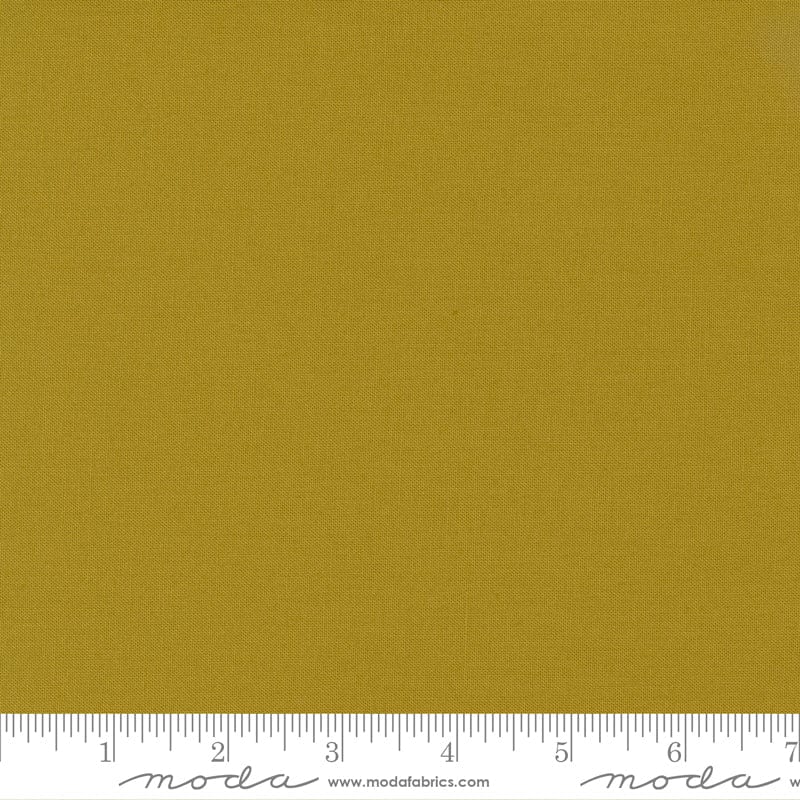 Cotton quilting fabric pattern called 'Bronze'. Part of the 'Bella Solids' fabric collection. Designed by Moda Fabrics for fabric company Moda Fabrics. SKU: 9900 420. 44-45 inch width.