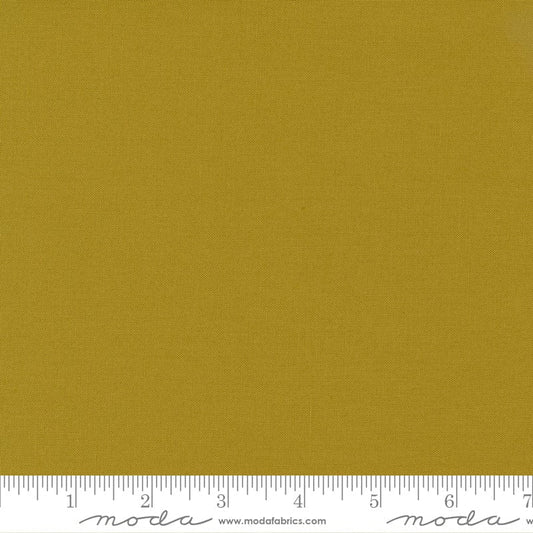 Cotton quilting fabric pattern called 'Bronze'. Part of the 'Bella Solids' fabric collection. Designed by Moda Fabrics for fabric company Moda Fabrics. SKU: 9900 420. 44-45 inch width.